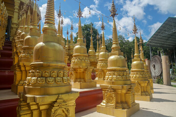 Saraburi / Thailand - July 26 2020: close up golden pagoda in rural temple for Buddhist worship