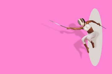 african woman jumping in fencing suit
