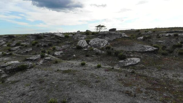 Drone pull back over rocky cliff edge, Asunden Raukfield, Sweden