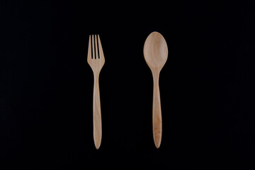 Wooden Spoon and fork on white background.
