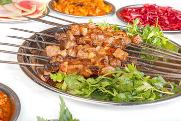 sis kebap. Turkish Sis Kebab. Traditional delicious Turkish foods; skewers cop sis. Grilling shashlik on barbecue grill. Turkish Sis Kebab isolated white background