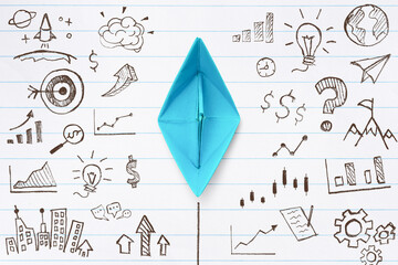 Business success, Innovation and solution concept, Blue paper ship and hand drawn business strategy...