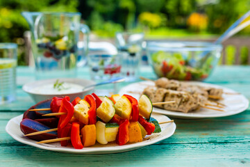 Vegetable skewers and grilled delicacies. Garden party.