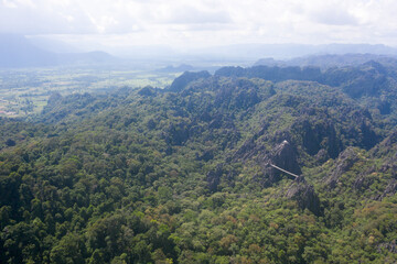Fototapeta premium Arial view of rock mountain in with cloudy sky