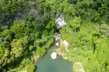 Fototapeta na wymiar Aerial view from drone show view of blue lagoon from cave at mountain in Laos.