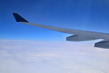 Fototapeta na wymiar Airplane in the sky. Wing of airplane