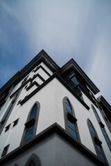Obraz premium facade of a building with long exposure clouds