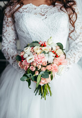 Wedding bouquet of the bride in women's hands. wedding flowers. Bridal bouquet of fresh flowers, wedding concept