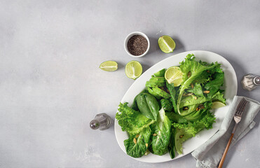 Obraz premium Diet green salad plate top view. Healthy food concept