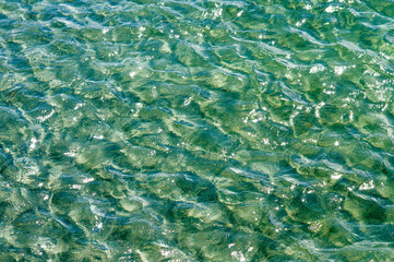 Sea water with sun reflection