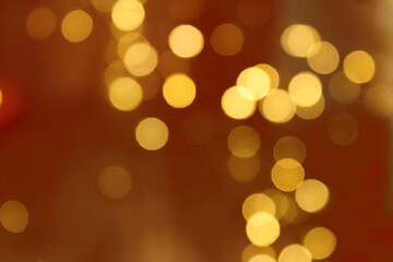 Golden bokeh gold background glitter blur celebration happy new year 2021 2022 christmas bright yellow lights on the dark background