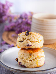 Traditional British scones with a tea cup and blurred background