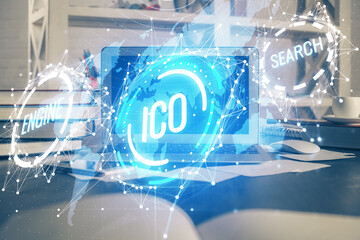 Multi exposure of blockchain theme hologram and table with computer background. Concept of bitcoin crypto currency.