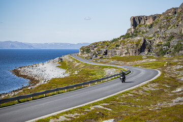 Motorcycle on the scenic county road 889 to Havøysund in northern Norway in summer