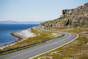 A cargo truck on the county road 889 in northern Norway in summer.