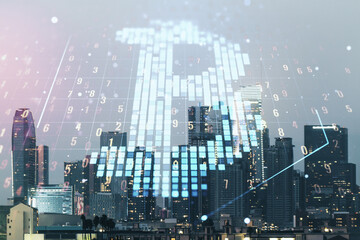 Virtual Bitcoin hologram on Los Angeles skyline background. Multiexposure