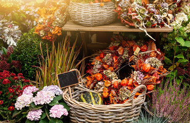 Autumn decoration at a flower shop on a street in a European city