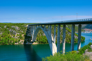 Sibenik Bridge across canyon of the Krka River. Panoramic view towards Scradin town.
