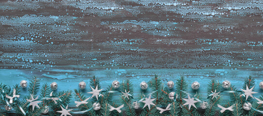 Darck panoramic Xmas background with fir twigs and Christmas decorations. Flat lay with decorated...