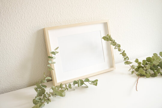 A3 / A4 Blank Frame with green eucalyptus leafs - landscape layout. Mockup Image