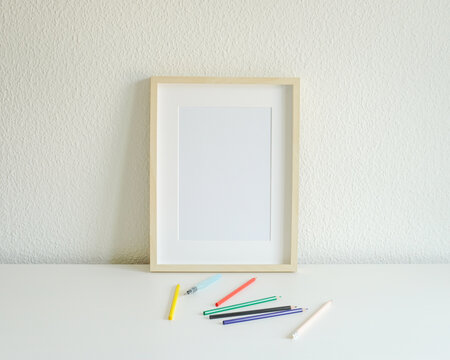 A3 / A4 Blank Frame with Coloring Pencils - portrait layout. Mockup Image