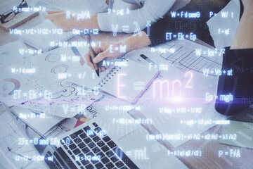 Science formula hologram over woman's hands taking notes background. Concept of study. Multi exposure