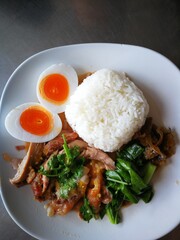 fried pork with rice and vegetables