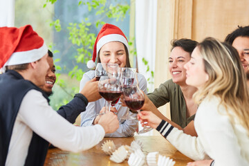 Friends celebrate Christmas party between Santa Claus and Christmas