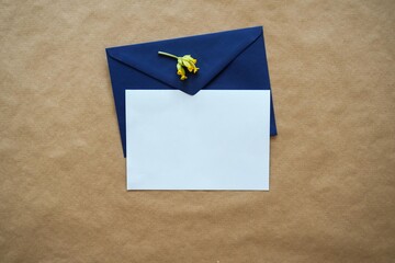 Wedding Invite Mockup /Flat Lay Card & Envelope with small yellow flower