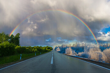 the auto road from winter to summer under the rainbow