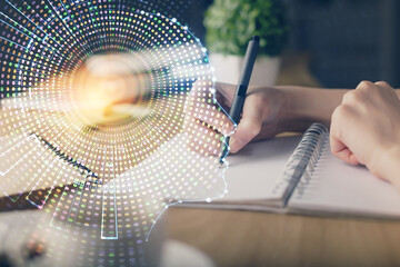 Multi exposure of writing hand on background with brain hologram. Concept of self learning.
