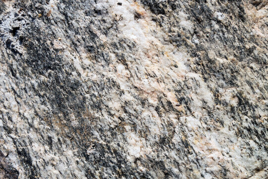 Rough surface of split granite stone with its granular and phaneritic in texture