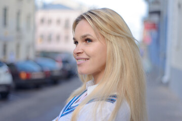 stylish blonde girl on the city street