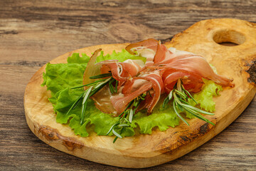 Sliced pork Jamon with rosemary