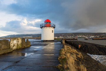 Burry Port Lighthouse situated on the breakwater of the harbour in Carmarthenshire, South Wales.