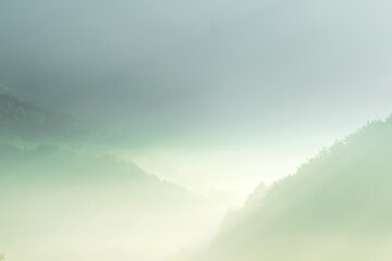 Beautiful misty morning dream valley mountain autumn fogy and clouds.