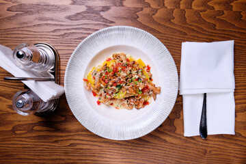 Pasta with chanterelles, sun-dried tomatoes and chorizo