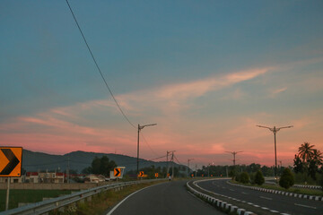 Fototapeta na wymiar sunrise on the road