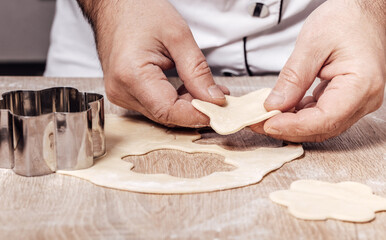 man using bakery mold for cookies