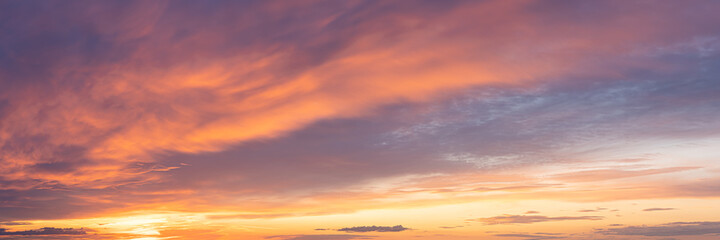 Vibrant color panoramic sun rise and sun set sky with cloud on a cloudy day.
