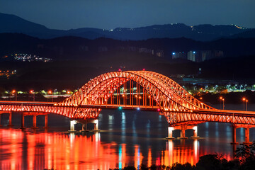 Beautiful and colorful night view of grand bridge and reflection