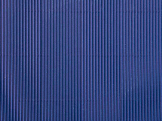 Empty blue colored corrugated background texture. The concept for image, text, design..