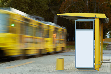 Empty billboard at tram stop. white vertical mockup on the bus stop. outdoor advertising