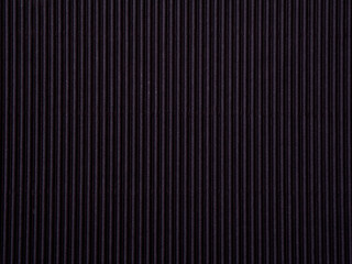 Empty black colored corrugated background texture. The concept for image, text, design..