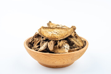 Burdock tea on a saucer on white background