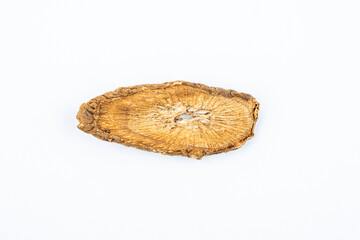 Chinese herbal medicine burdock root slices on white background