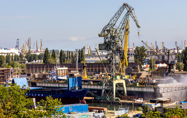 Fototapeta na wymiar Panoramic view of Gdansk Shipyard industrial infrastructure near European Solidarity Centre building at Solidarnosci square in Gdansk, Poland