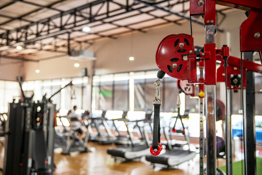 Closeup picture of hanging handle machine in a gym for pulling training