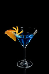 Orange decor Martini Blue Curacao on a black background