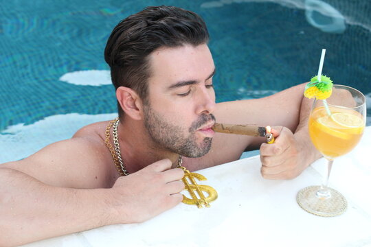 Wealthy Man Lighting A Cigar In Swimming Pool 